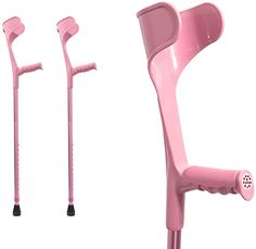 two pink crutches with handles and holes on each side, one has a hole in the middle