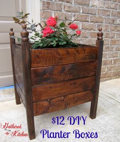 a wooden planter box with flowers in it and the words, $ 12 diy planter boxes