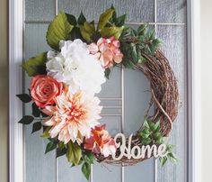 a wreath with flowers and the word home on it