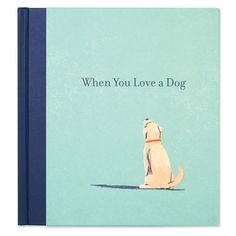 a book with a dog sitting on the floor and it's cover is blue