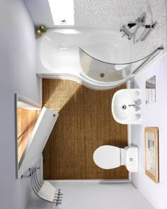 an overhead view of a bathroom with sink, toilet and bathtub