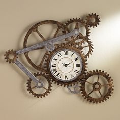 a clock with gears attached to the wall