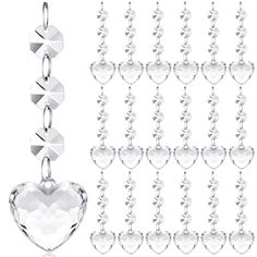 a set of silver chain with heart charms on each side and an image of a crystal heart