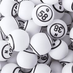 many white balls with numbers are stacked together