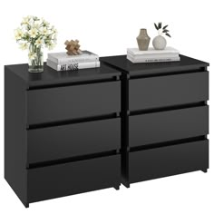 two black dressers with flowers and books on each side, against a white background