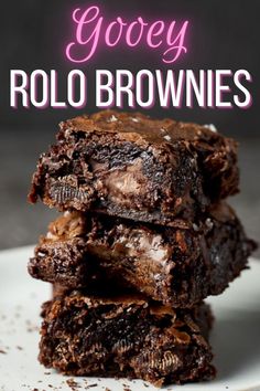 three chocolate brownies stacked on top of each other with the words gooey rolo brownies above them