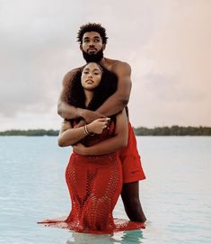 a man and woman embracing in the water