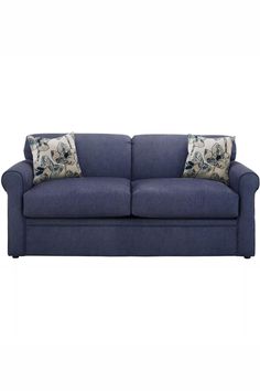 a blue couch with two pillows on the back and one pillow sitting on top of it