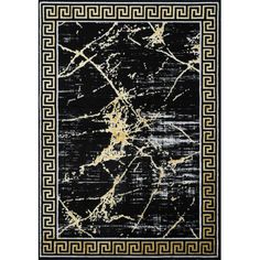 a black and gold area rug with an intricate design on the center, in front of a white background