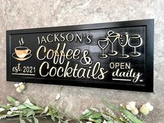 a wooden sign that says jackson's coffee and cocktails daily on the wall