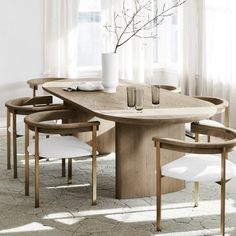 a dining table with four chairs around it