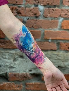 a person with a colorful tattoo on their arm