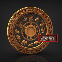 a golden clock with zodiac signs on it