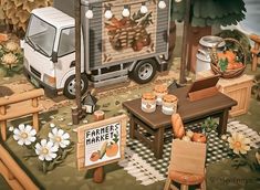 a truck parked in front of a farmers market with pumpkins and other items on the ground