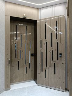 two wooden doors with glass inserts in a room