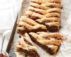 several pieces of pie sitting on top of parchment paper