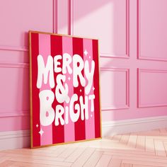 a merry and bright sign in front of a pink wall with wooden flooring next to it