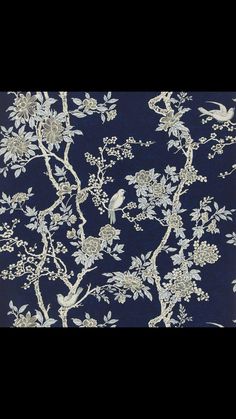 a blue and white wallpaper with birds on it's branches, in front of a black background