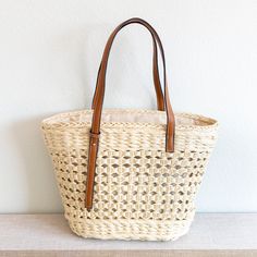 Elena Handbags Straw Basket Tote Bag Shopping Straw Bag With Woven Leather Double Handle, Rectangular Open Weave Bucket Bag, Beige Woven Leather Straw Tote Bag, Trendy Jute Straw Bag For Shopping, Casual Straw Bag With Woven Leather And Double Handle, Straw Bag With Braided Handles For Shopping, Casual Basket-shaped Crochet Bag With Woven Leather, Casual Basket-shaped Woven Leather Bag, Chic Woven Leather Basket Straw Bag