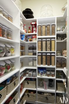 an open pantry filled with lots of food and containers on shelves next to each other