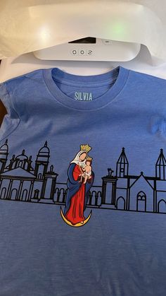 CHINITA UNISEX T-SHIRT | Virgin of Chiquinquira | Basilica | Santa Lucia Church | Maracaibo | Zulia --------------------------------------------------------------- - UNISEX T-SHIRTS - - NO REFUNDS - - PRODUCTION TIME 3-7 business days - - SHIPPING TIME 3-7 business days - --------------------------------------------------------------- Santa Lucia Day, Santa Lucia, Orlando Fl, Orlando, Unisex T Shirt, Gender Neutral, Adult Outfits, Tops & Tees, Top Outfits