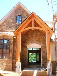 the front entrance to a home under construction with stairs leading up to it's entry