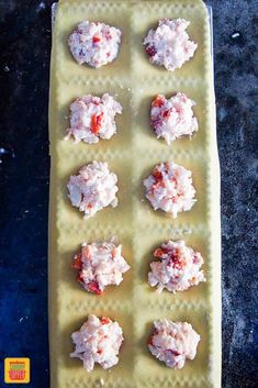 there are many small bites of food on the cookie sheet that is ready to be eaten