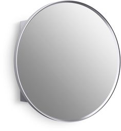 a round mirror mounted on a wall with a metal frame and silver trim around the edges