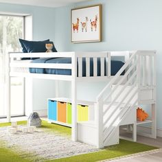 a white bunk bed sitting next to a green rug