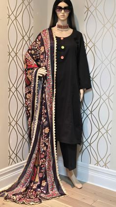 Pakistani designer Shanzay's Vogue 3 piece Doria cotton stitched outfit with multi mirror work Silk shawl. The shirt is stitched in A-line style. The fabric used for shalwar kameez is Doria cotton.  Full bell bottom sleeves.  matched with mirror work Silk shawl finished with Golden lace trim all around.    COLOR: Black/ Multi MEASUREMENTS: shirt length:          42 inches                                    Medium chest:      20 inches Small chest:           19 inches Trouser length:      37 inch Bell Bottom Sleeves, Golden Lace, Colored Fabric, Silk Shawl, Oil Water, Shalwar Kameez, Mirror Work, Small Chest, Bell Bottom