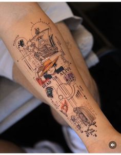 a person with a tattoo on their arm that has pictures and words all over it