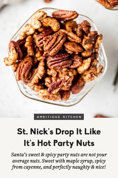 a glass bowl filled with nuts on top of a table