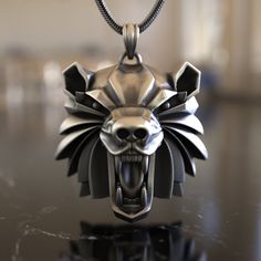 an animal's head is displayed on a black counter top with a chain attached to it