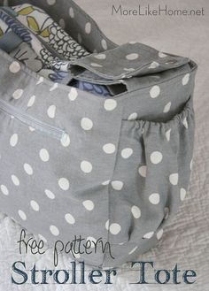 a polka dot bag sitting on top of a bed with the words free pattern stroller tote