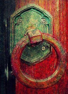 a red door with a metal handle on it