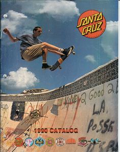 a man riding a skateboard up the side of a ramp at a skate park