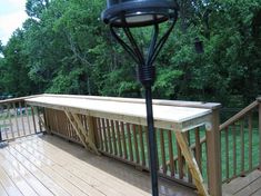 a lamp on top of a wooden deck