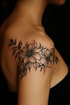 a woman's shoulder with flowers on it