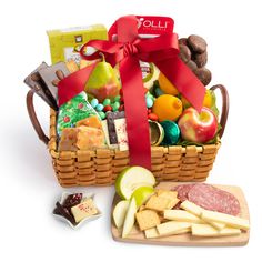 a basket filled with fruit and cheese next to crackers on a cutting board in front of a white background