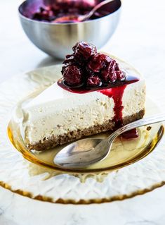 there is a piece of cheesecake with cherries on it