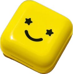 a yellow smiley face with stars on it