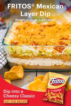 an advertisement for a mexican layer dip, with chips and salsa in the foreground