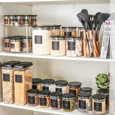 the shelves are filled with various types of spices and other things to cook in them