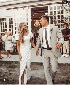 a man and woman are walking together outside