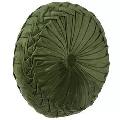 a green round pillow on a white background