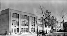 an old black and white photo of a building