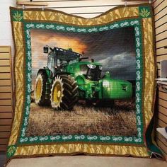 a large green tractor on a farm field