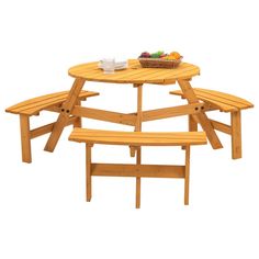 a wooden picnic table with two benches and a bowl of fruit on it's top