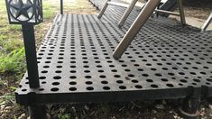 there is a metal platform that has holes on it