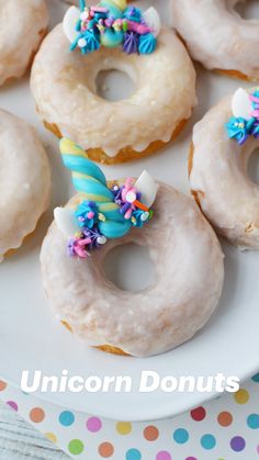 unicorn donuts on a plate with sprinkles